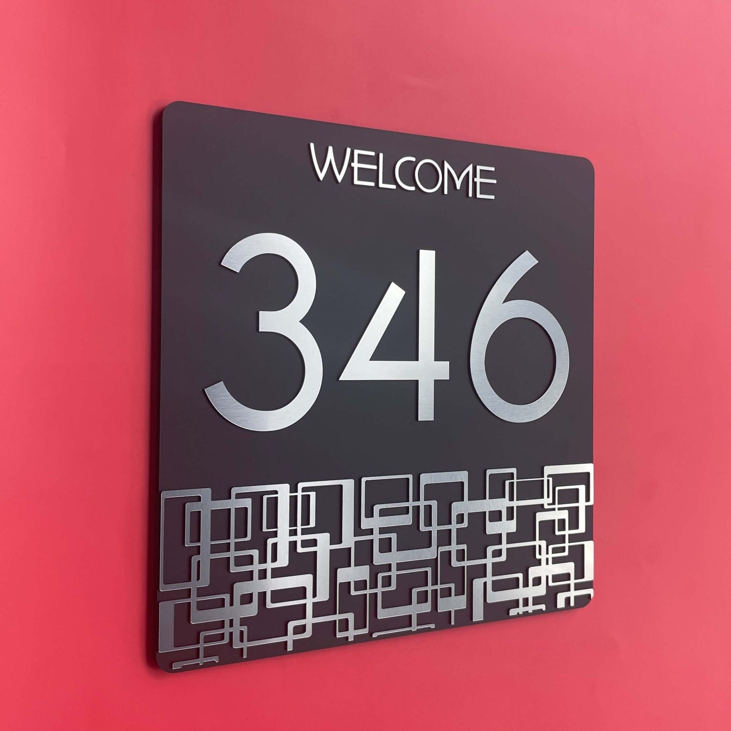 Australian made SW2 house number sign with '346' and geometric design on red wall, simple DIY installation, 290mm x 290mm.