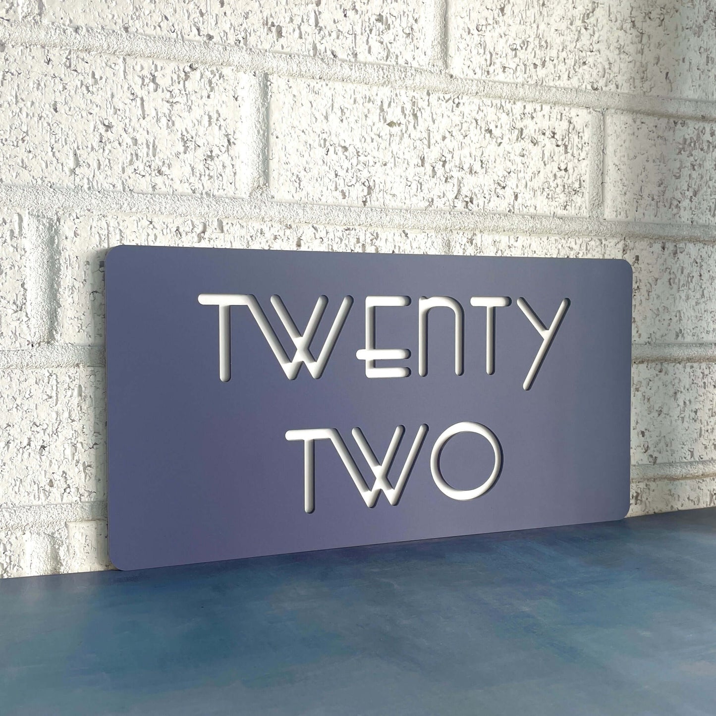 SW2 house number sign reading 'TWENTY TWO', Australian-made, easy DIY install, weather-resistant for brick or concrete surfaces.