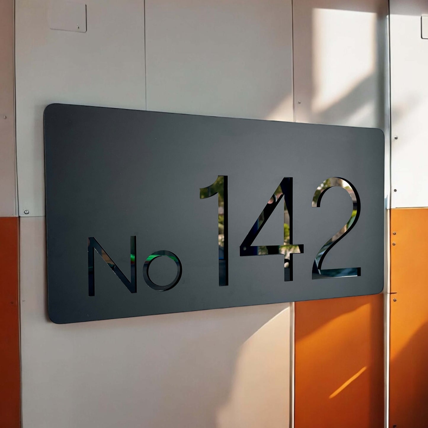 Modern Australian-made house number sign shown as "No 142" in sleek design, suitable for 2-3 numbers. Simple DIY installation. SW2 product.