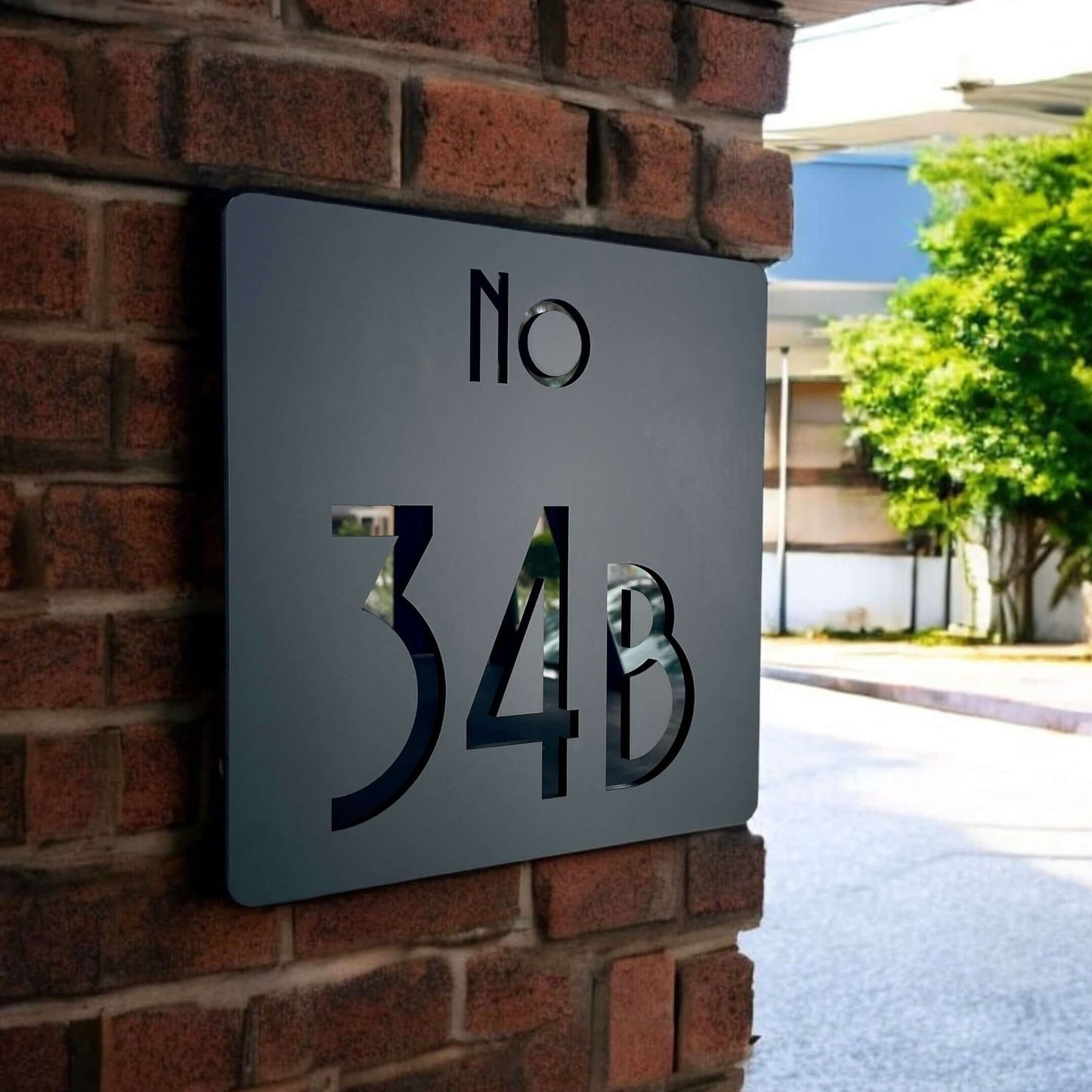Modern house number sign 34B on brick wall, Australian-made Prisma 4, sleek design, SW2 house number sign, easy installation.