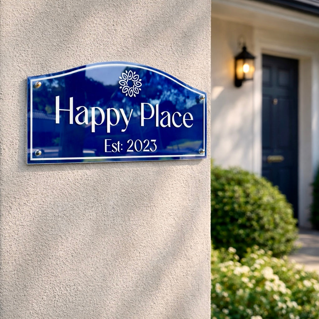 Heritage traditional acrylic house name sign in royal blue with gold vinyl lettering "Happy Place Est. 2023" mounted on a light rendered wall at a period-style entrance