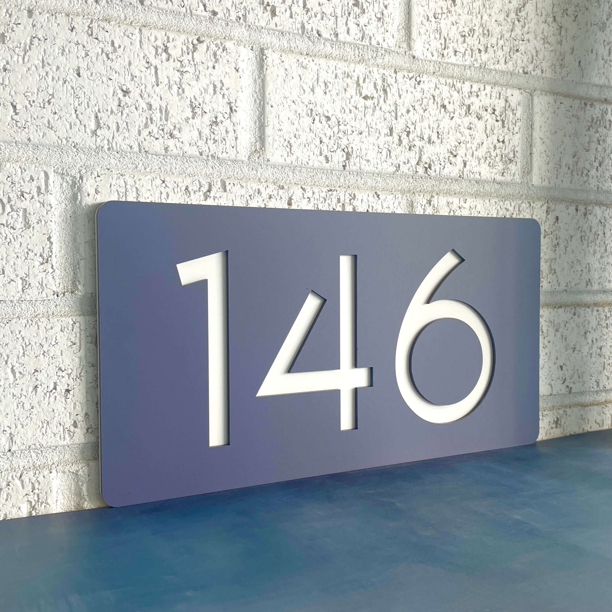SW2 house number sign displaying '146', Australian made, sleek design with simple DIY installation, suitable for flat surfaces.