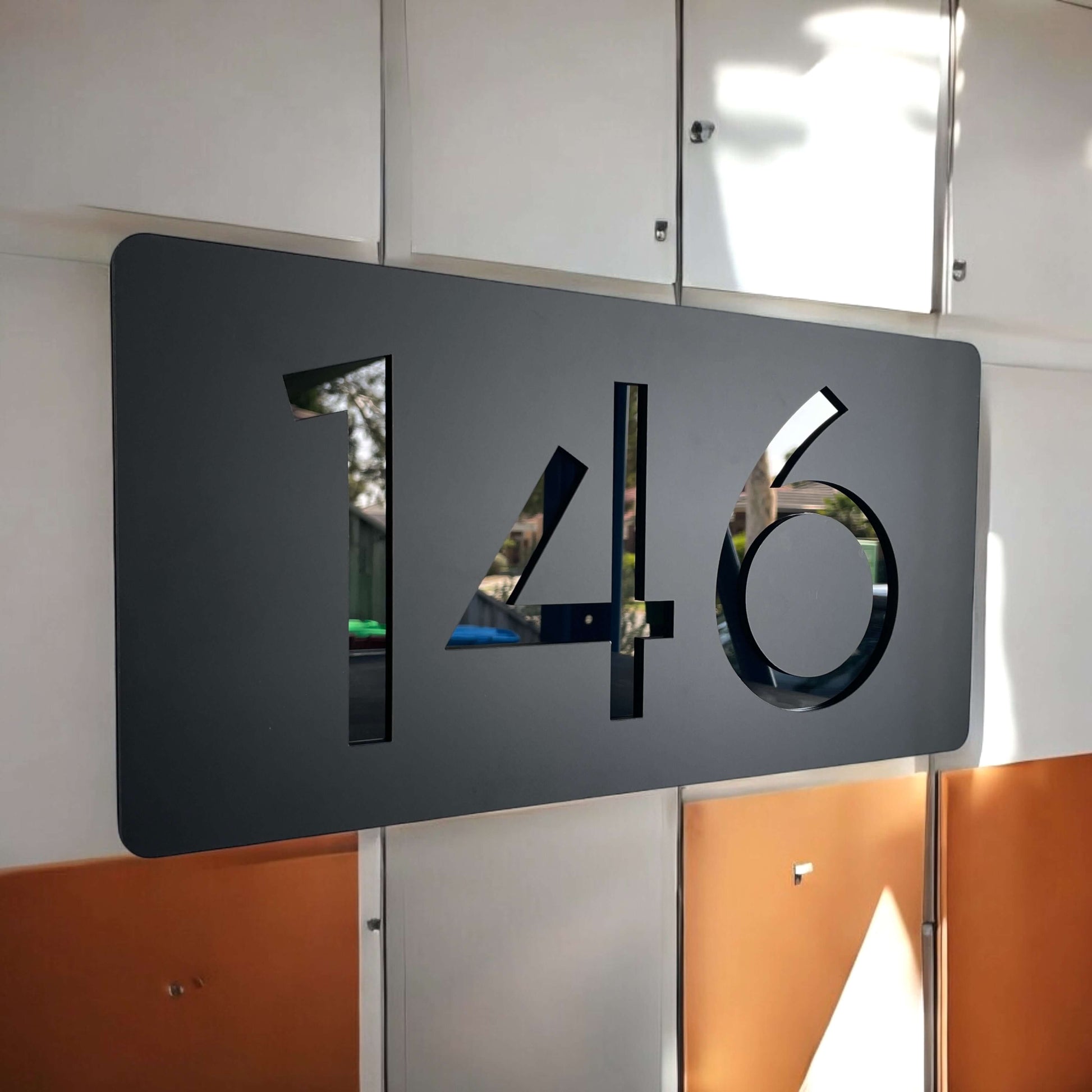 Modern "146" house number sign, Australian made, mounted on a wall, part of the SW2 collection, size 320mm x 180mm x 6mm.