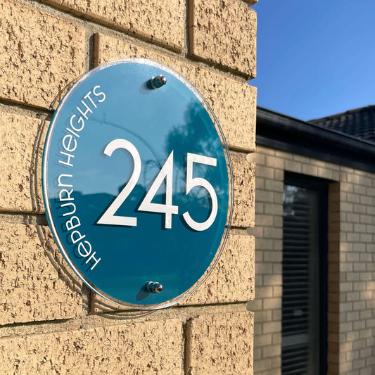 Australian-made house number sign '245' on brick wall, SW2 style, 230mm diameter, easy DIY installation, weather-resistant.
