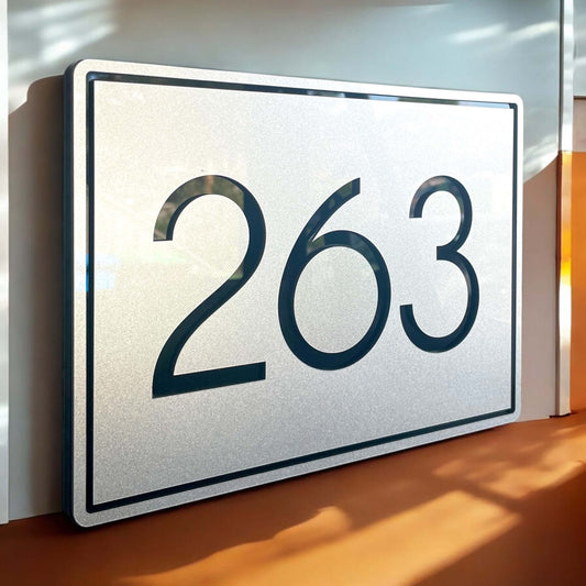 House number sign featuring number 263 with floating mount, matte black acrylic, and silver finish. SW2 house number signs.