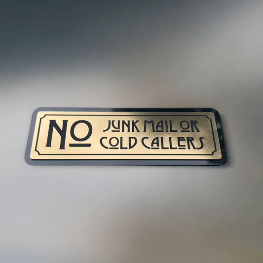 Stylish "No Junk Mail or Cold Callers" sign in metallic gold acrylic from SW2 house number sign collection.